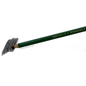 A green General Pencil Co. Kimberly® graphite pencil is shown against a white background. The pencil tip is shading a dark, textured patch of graphite on a piece of paper. The engraved text "KIMBERLY®" is visible on the pencil's body.