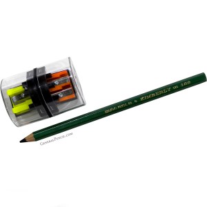 An angled view of a green Kimberly® pencil by General Pencil Co. next to a clear cylindrical sharpener with three holes, each tagged with different letters (L, M, S). Inside are orange, yellow, and green shavings.