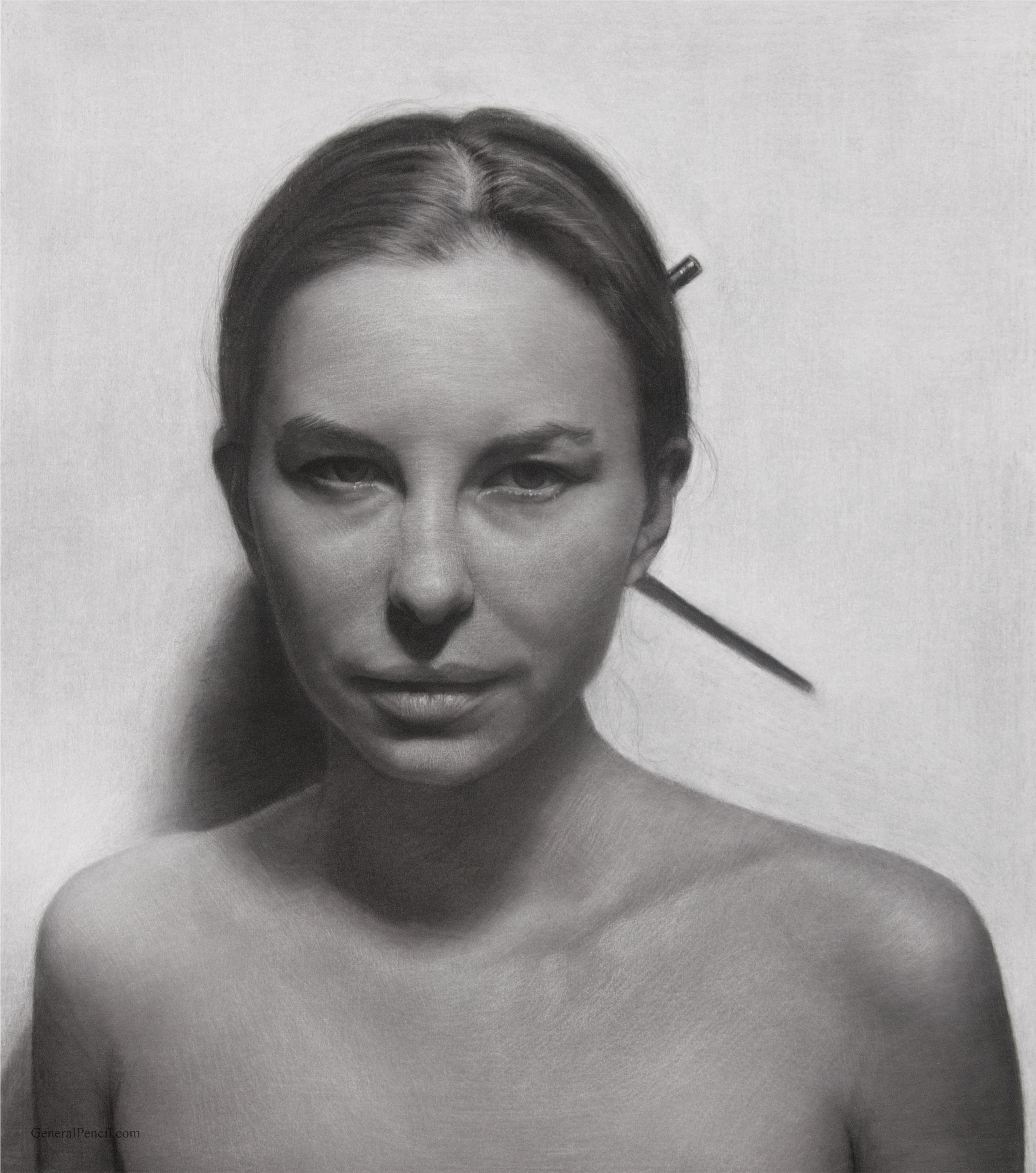 A grayscale portrait of a woman with a neutral expression, her hair pulled back with a pencil tucked in it. She is facing forward against a plain background and is shown from the shoulders up. The image has a realistic, high-contrast graphical style. Artist Dvid Kassan.