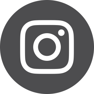 The Instagram logo: a white outline of a camera with a circular lens and a small circle in the top right corner, set against a dark gray circular background.