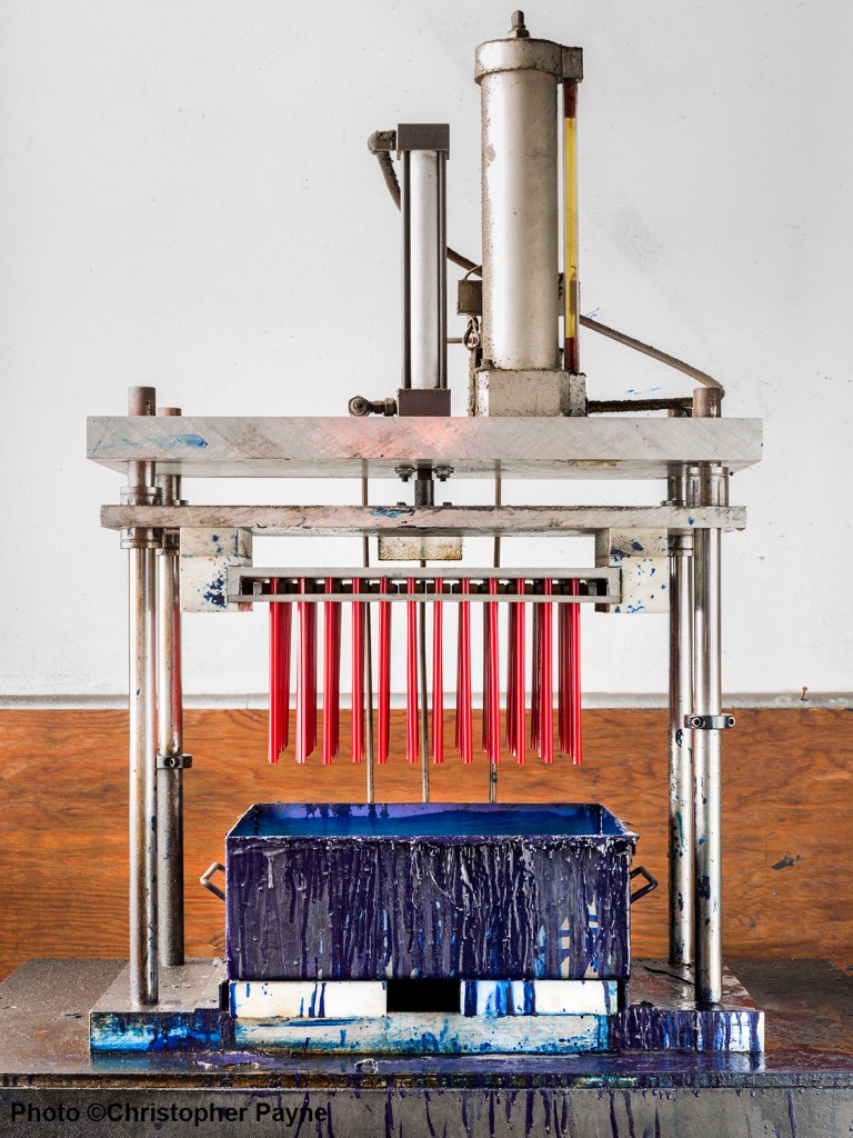 A machine with red tubes in it.